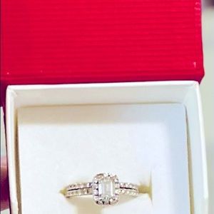 1.5 total karat engagement set. Emerald cut center stone.